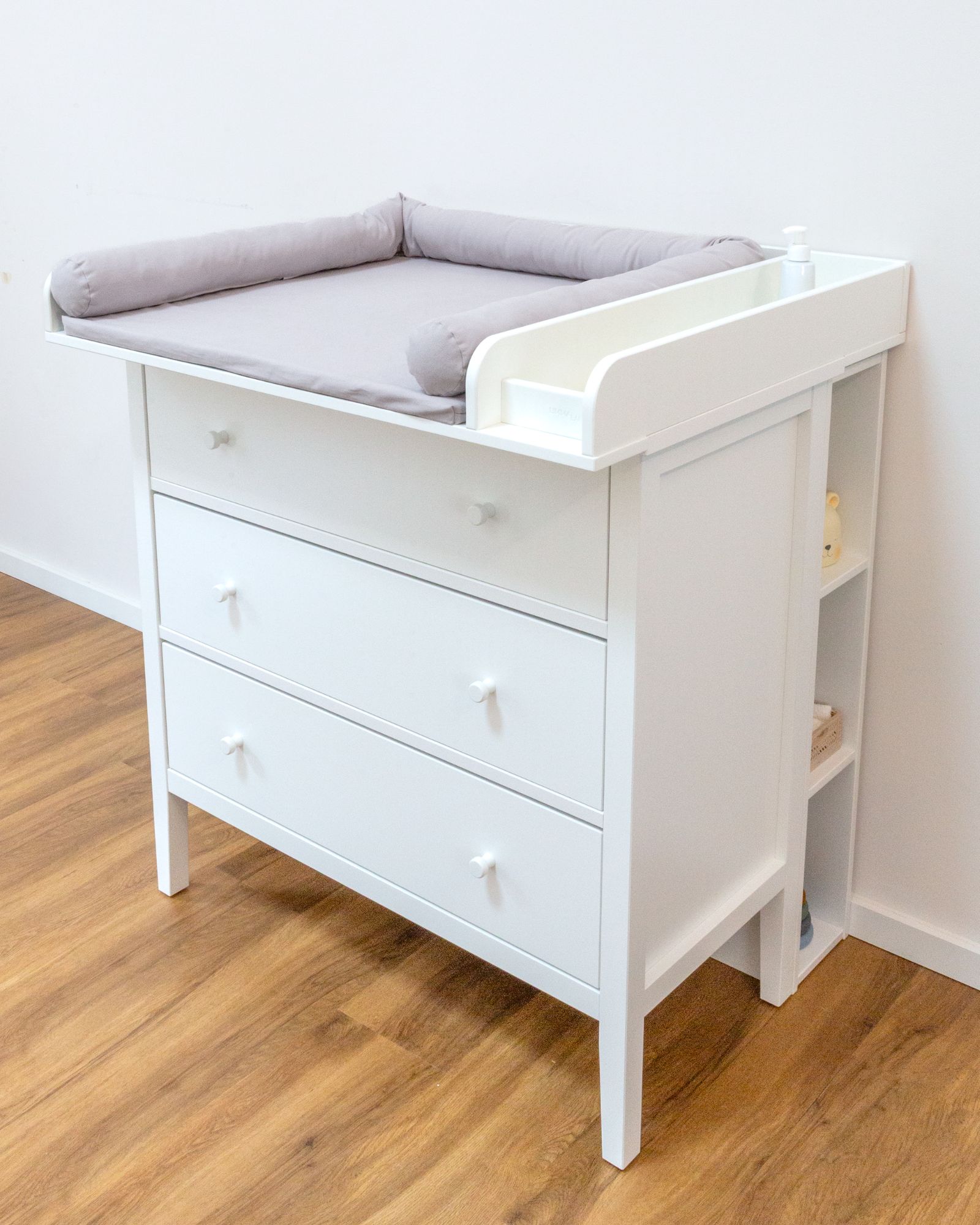 we baby dresser, changing table, padded changing pad, white furniture, wooden legs